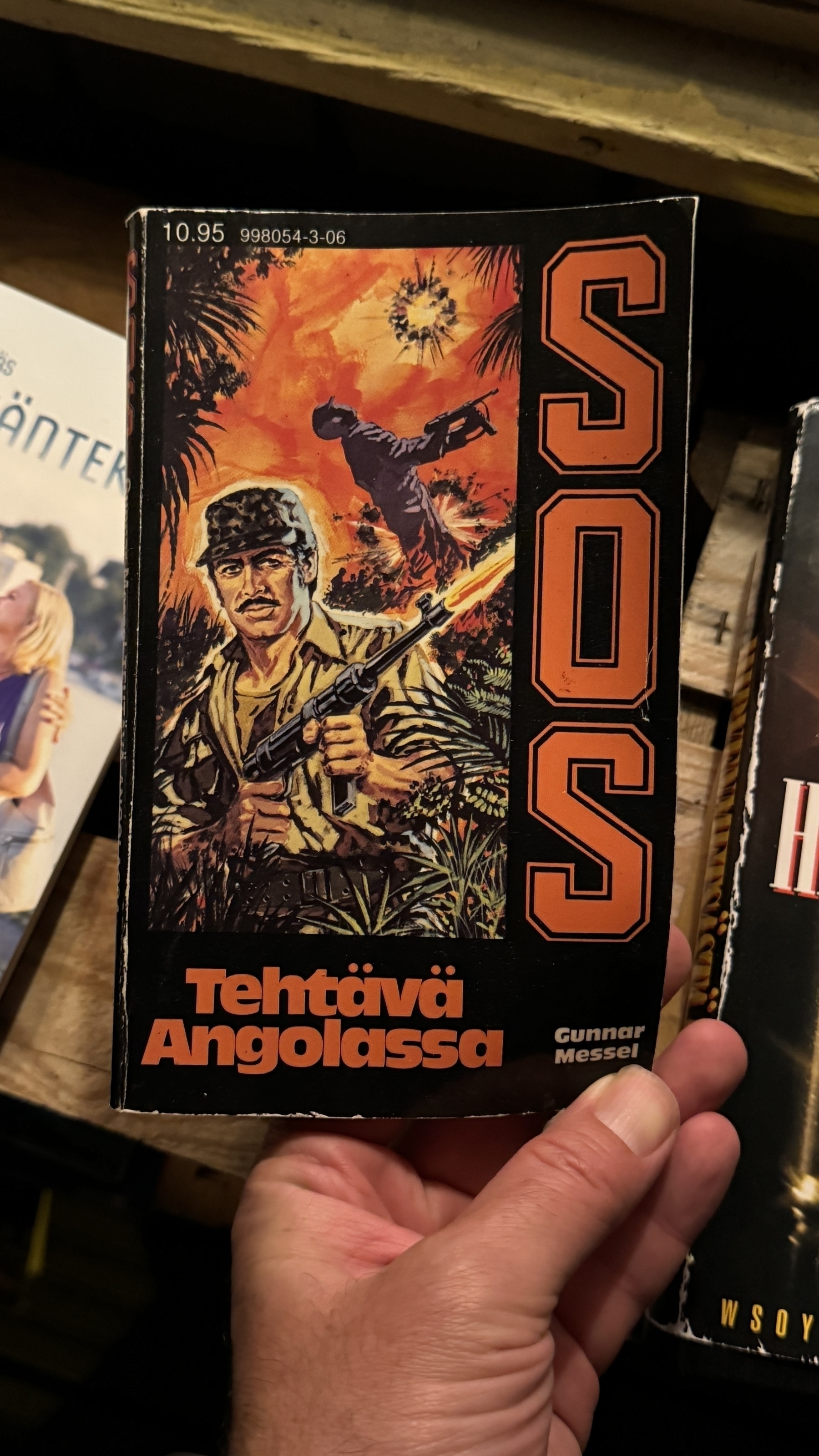 A military-themed book cover depicts a soldier with a rifle, alongside the text "SOS".