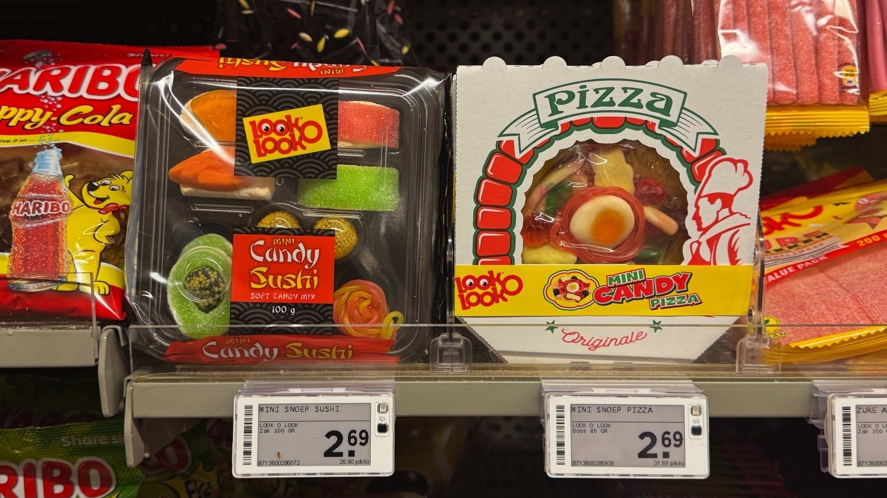 Mini Look O Look Candy Sushi and Pizza packs are displayed on a shelf with a Coca-Cola.