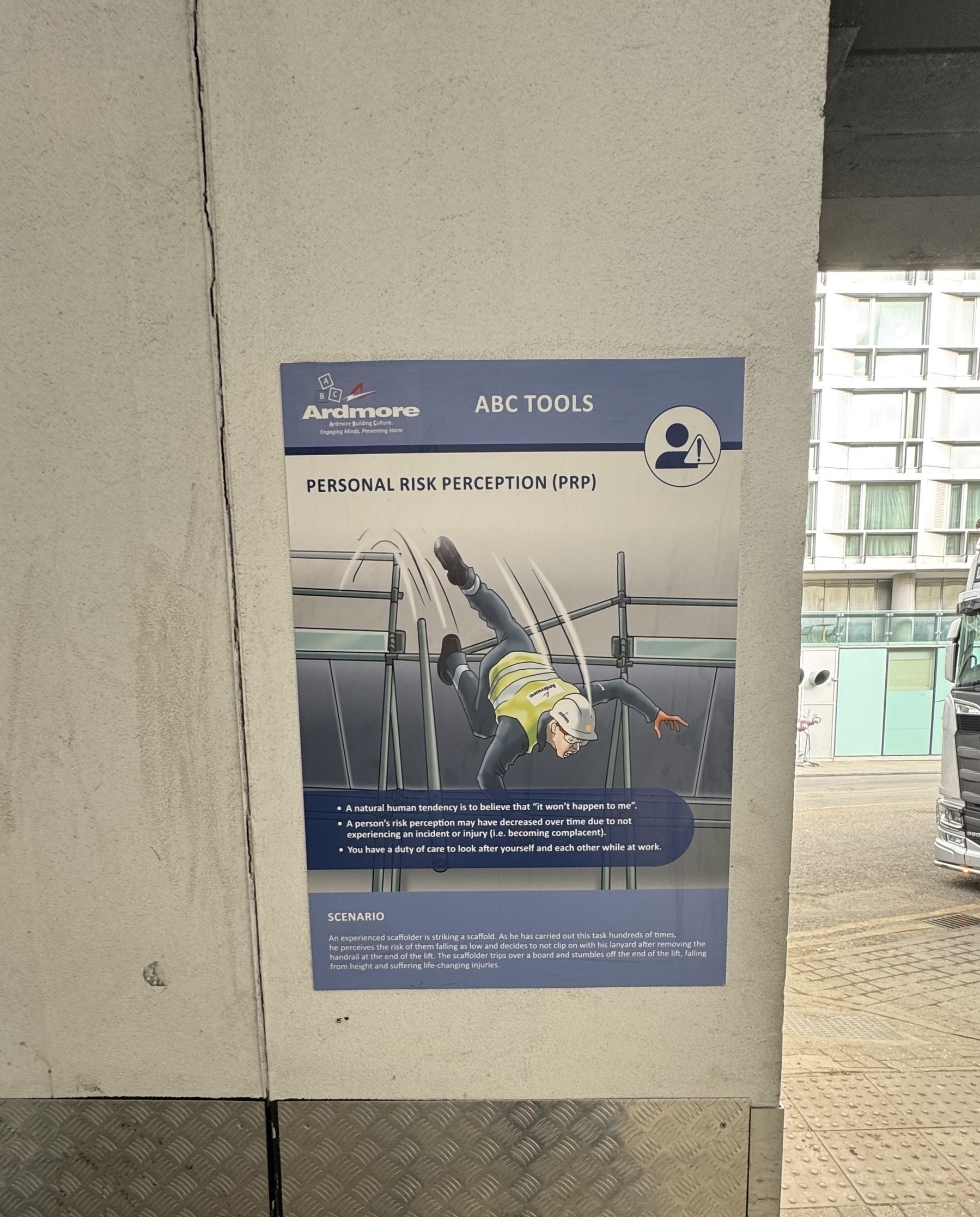 Here's a factual alt-text description of the image: A worker is shown falling over the end of a lift, highlighting the importance of personal risk perception and vigilance.