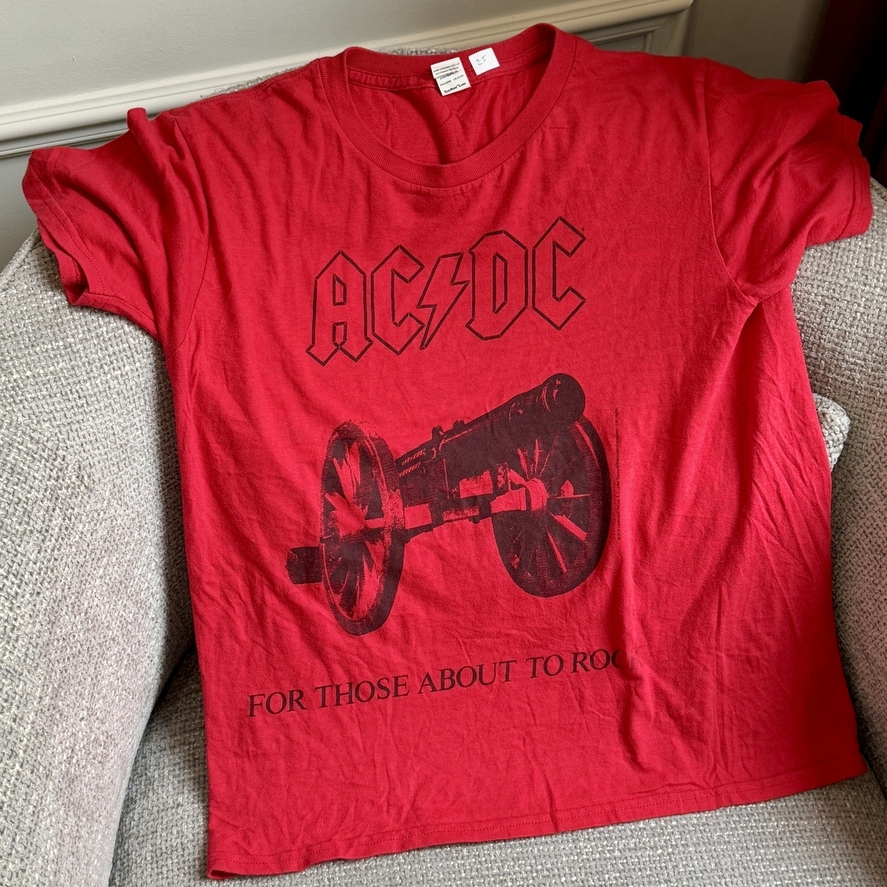 Red t-shirt with "AC/DC" text and a train wheel graphic.