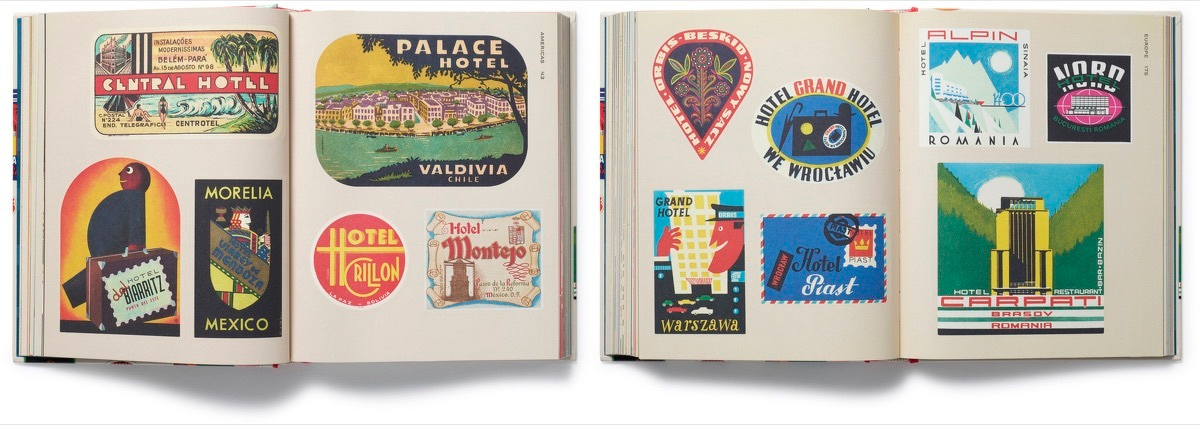 Vintage hotel luggage labels spread across a desk - colorful international travel ephemera and stickers.
