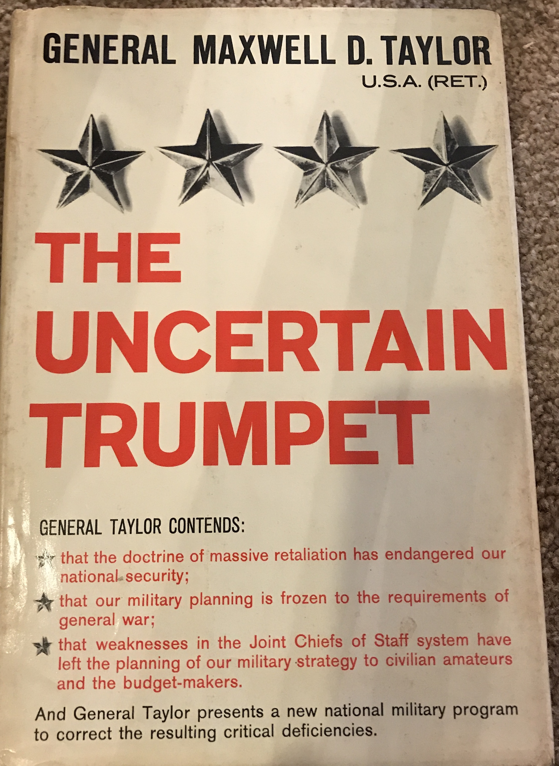 A poster featuring General Maxwell D. Taylor advocating for a new national military plan.